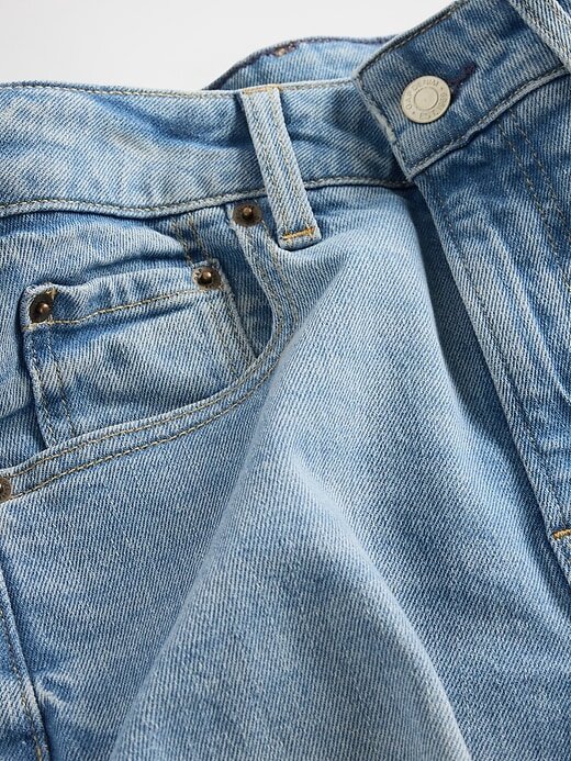 Calça jeans larga com passada alta e curvas no tornozelo Calça jeans larga com passada alta e curvas no tornozelo