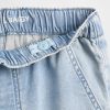 Calça jeans larga infantil de malha de cintura baixa Calça jeans larga infantil de malha de cintura baixa