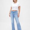 Calça jeans longa e justa com cintura baixa e curvas