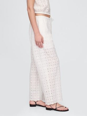 Calças largas com ilhós de cintura média