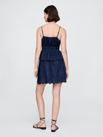 Mini saia jeans com ilhós