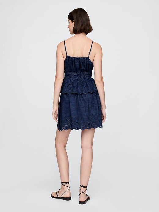 Mini saia jeans com ilhós Mini saia jeans com ilhós