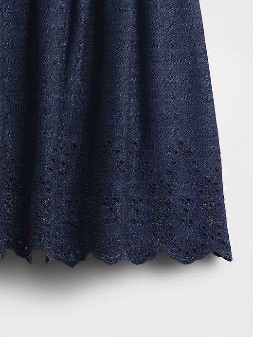 Mini saia jeans com ilhós Mini saia jeans com ilhós