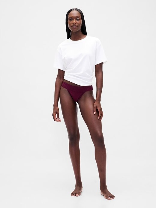 Tanga de algodão orgânico elástico com acabamento em renda Tanga de algodão orgânico elástico com acabamento em renda