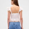 Top cropped em renda voile peplum com babados